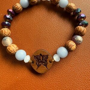 Elegant Beaded Bracelet with Purple and Brown Accents